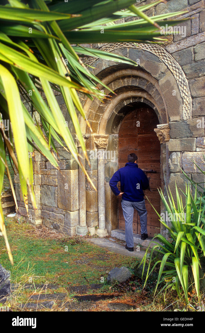 Front door of `La Assumpció´ church.Romanesque church.Coll.Boí valley.Lleida province. Catalonia. Spain Stock Photo